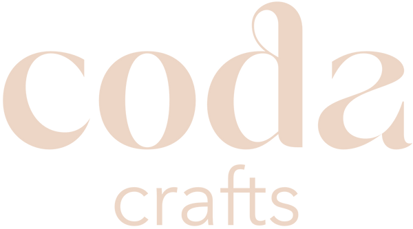 Logo of 'coda crafts' with a soft beige colour on a transparent background